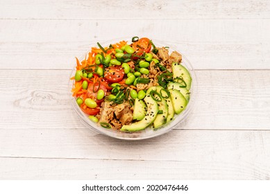 Bowl With Vegan Chicken Substitute, Chopped Cherry Tomatoes, Shredded Carrot, Edamame Beans, Avocado Slices And White Rice Base