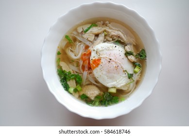 Bowl Of Vietnamese Chicken Pho With An Poached Egg. Pho Ga With Egg. Rice Noodle Soup.