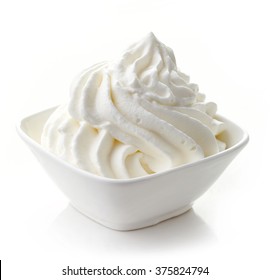 bowl of whipped cream isolated on white background