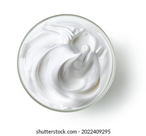bowl of whipped egg whites and sugar cream isolated on white background, top view