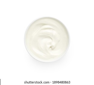 Bowl of white creamy yogurt isolated on white background, top view, flat lay