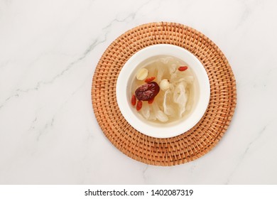 A Bowl Of White Fungus Lotus Seeds On The Table