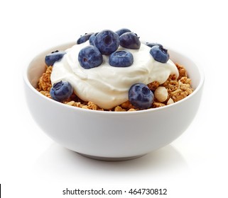 Bowl of whole grain muesli with blueberries and yogurt isolated on white background - Powered by Shutterstock