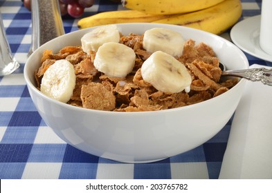 A Bowl Of Whole Grain Wheat Cereal With Bran And Sliced Banana