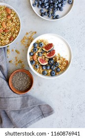 Bowl With Yoghurt, Granola, Chia Seeds And Berries. Flat Lay Healthy Breakfast