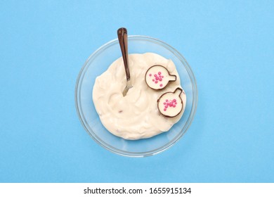 bowl of yougurt or white cream on blue wall, top view - Shutterstock ID 1655915134