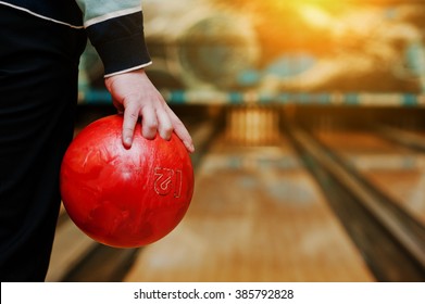 Bowling Ball At Hand Of Man Background Bowling Alley