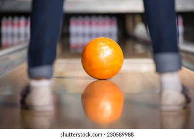 Bowling Ball Is Rolling Down The Path To The Bowling Pins.