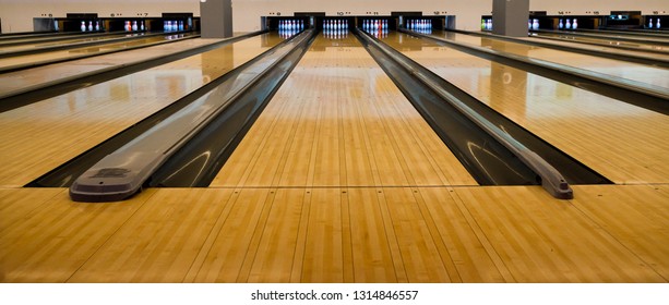 Bowling balls and wooden lane. 