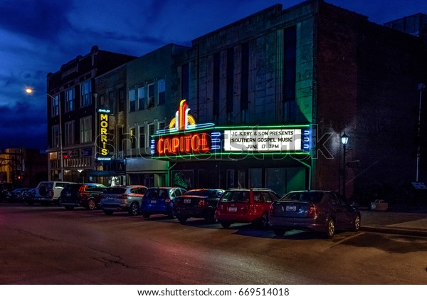 Bowling Green, Kentucky, USA - June 22, 2017: The\
illuminated marque of the Capitol Theater in downtown Bowling Green\
at night.