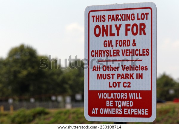 BOWLING GREEN, KY - AUGUST 2: A United Auto\
Workers parking sign located in Bowling Green, Kentucky on August\
2, 2014. The UAW is an American labor union that represents workers\
in the US and Canada.