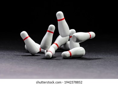 Bowling. Image Of Knocked Down Pins On A Black Background. Copy Space. Space For Text