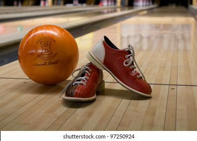 Bowling Kit With Shoes And Ball On The Alley