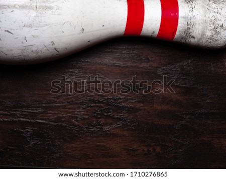 bowling pin with dark hardwood texture