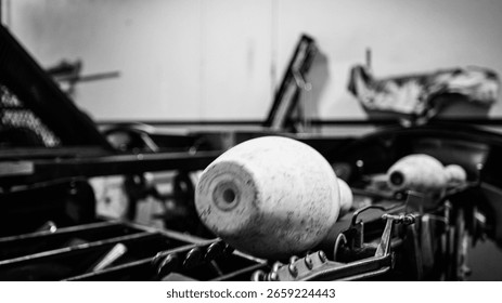 Bowling pin setting machine. Close-up of bowling alley pinsetter mechanics resetting pins.