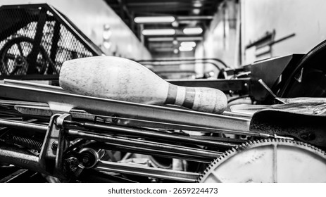 Bowling pin setting machine. Close-up of bowling alley pinsetter mechanics resetting pins.