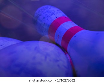 Bowling Pins Falling Down During Cosmic Light Show