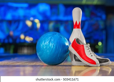bowling shoes and ball for bowling game on the background of the playing field, copy space 