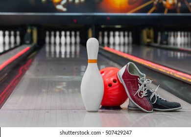 bowling shoes and ball for bowling game on the background of the playing field