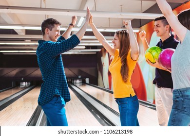 Bowling Team Celebrating Win With High Five. Team Building.