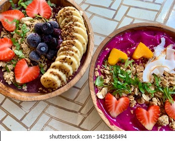 Açaí Bowls From Above, Acai Bowl And Dragon Fruit Smoothie Bowl. Delicious Healthy Food Topped With Fresh Fruit And Granola.