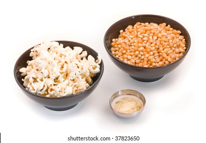 Bowls With Corn, Popcorn And Melted Butter Over White Background