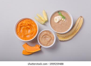 Bowls With Healthy Baby Food On Color Background. Purees, Made Of Fresh Organic Fruit And Vegetables, Flay Lay, Top View, Concept. Kids Meal