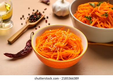 Bowls Of Korean Carrot Salad On Color Background