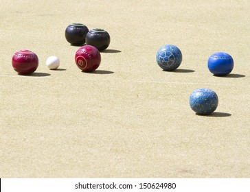 Bowls Or Lawn Bowls Is A Sport Played On Outdoor Lawn Which Is Natural Grass Or Artificial Turf.  The Objective Of The Game Is To Roll Biased Balls To Stop Close To A Smaller Ball  Jack Or Kitty.