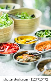 Bowls Of Mixed Fresh Organic Vegetables In Modern Salad Bar Display