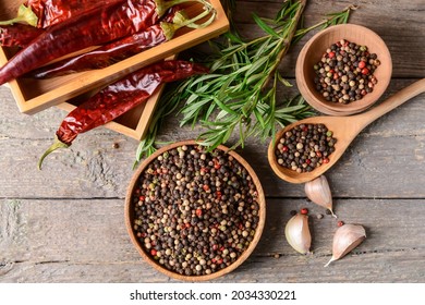 Bowls with peppercorns on wooden background - Powered by Shutterstock