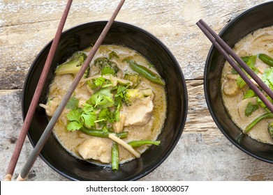 Bowls Of Tasty Thai Green Curry Served With Chopsticks Made From Nutritional Bean Sprouts, Broccoli, Chicken, Coconut Milk, Coriander,and Green Beans, View From Above