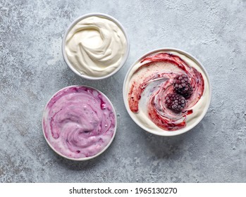 bowls of various yogurts, top view - Shutterstock ID 1965130270