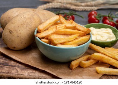 Bown with fresh cooked french fries potato chips with belgian mayonnaise sauce close up