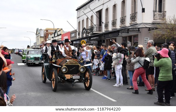 Bowral,\
Australia - Sept 22, 2018. Tulip Time Street Parade features\
classic and vintage cars, marching bands and various floats. Locals\
and visitors line the street to celebrate\
Spring.
