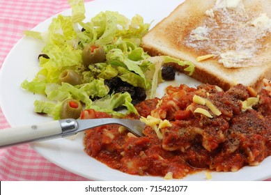 Bowtie Pasta In Spicy Tomato Sauce And Parmesan Cheese With Green Salad And Garlic Toast.