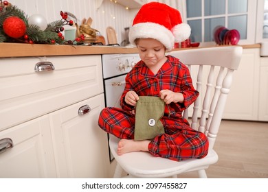 box with advent calendar green bag sits at modern white and wooden kitchen - Powered by Shutterstock