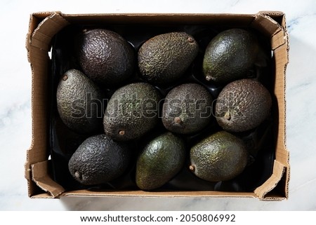 a box of avocado on the table 