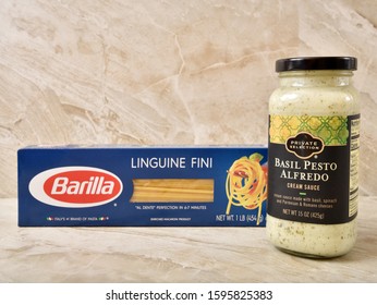 A Box Of Barilla Linguine Fini With A Bottle Of Private Selection Basil Pesto Alfredo Sauce.  Illustrative Editorial