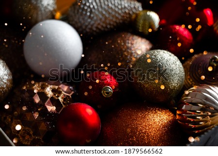 Box with christmas balls and new year decorations. Top horizontal view copyspace bokeh lights