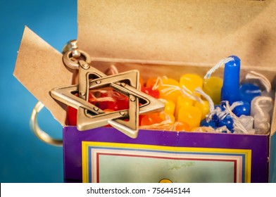 A Box With Colorful Hanukkah Candles. Hanukkah Is A Jewish Holiday Of Light That Falls Usually On December And Sometimes Coincides With Christmas. Hanukkah Candles, Hanukkah Concept Image.