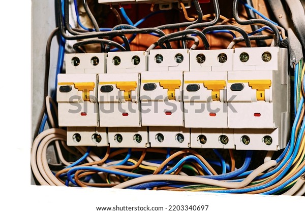  A box containing a junction of electric wires or\
cables close up