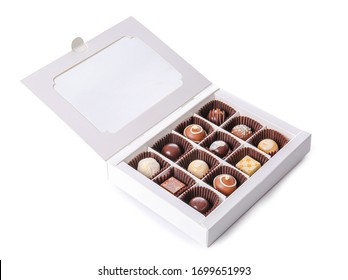 Box with delicious chocolate candies on white background
