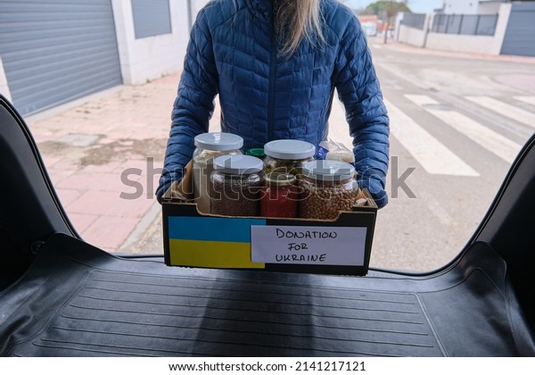 Box with donation food for ukrainian refugees\
suffering from war. Ukraine\
war