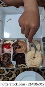 Box With Donuts. Several Flavours Like Coconut, Chocolate And Strawberry Candies. Cakes For Afternoon Tea.  Bali, Indonesia. 02.11.2022