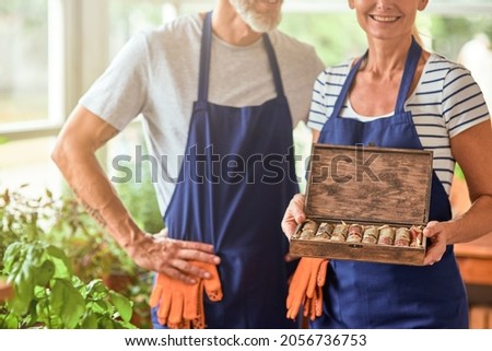 Box with dried spices in woman hands