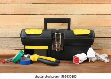 Box With Electrician Tools On Wooden Background