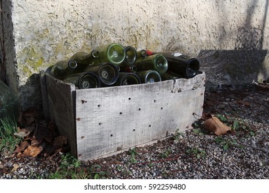 Box of empty bottles of wine