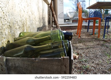 Box of empty bottles of wine