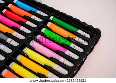 Similar – Image, Stock Photo Rows of colored pen markers on a pastel pink background